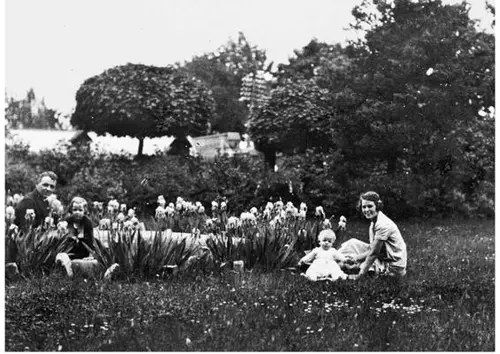 Outside in the garden in Oppeln: Karl, Charlotte, baby Frederick and Margarete, circa 1925–1926