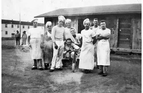 Frederick wearing his chef’s hat along with other POWs assigned to the mess hall